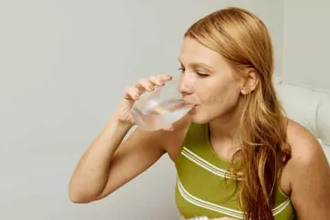 mounjaro dosage and maintenance | woman drinking water