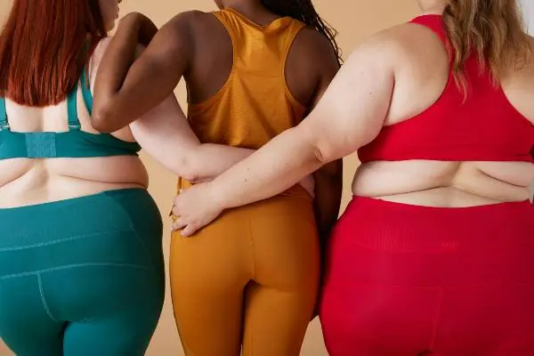 who cannot take mounjaro | the backs of three women in a row wearing athletic wear