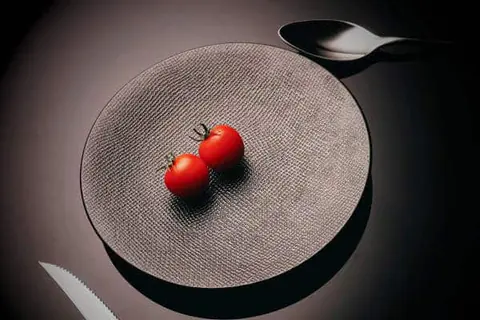 Still Hungry on Mounjaro | Two tomatoes on a grey plate