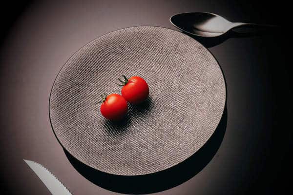 Still Hungry on Mounjaro | Two tomatoes on a grey plate
