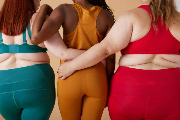 who cannot take mounjaro | the backs of three women in a row wearing athletic wear