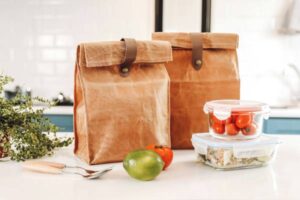 How to Get Back into a Healthy Routine | Lunch Bags on Table With Healthy Food