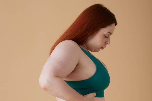 is wegovy as effective as mounjaro? | red-haired woman in activewear looking down