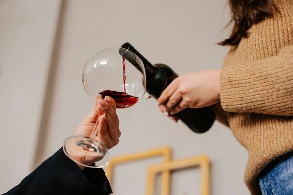 wegovy and alcohol | woman pouring a glass of red wine