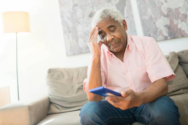 is wegovy 7.2 mg safe? | man on sofa in pink shirt looking at phone concerned