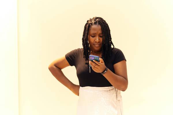 wegovy 7.2 mg vs 2.4 mg dose | woman looking on phone with concerned expression
